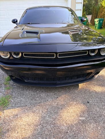 Front view of a black Dodge Challenger.