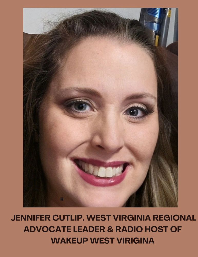 Close-up portrait of a smiling woman with makeup and light eyes.
