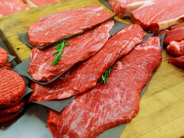 beef steaks on paper separators