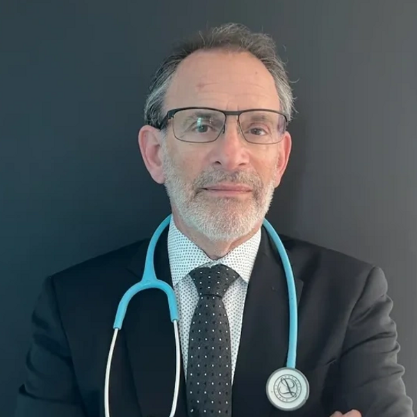 doctor wearing blazer and tie with stethoscope