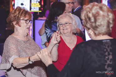 Guests dancing and smiling during a wedding reception at Heritage Hotel in Southbury, Connecticut.