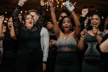 guest with their hands up, rocking to the beat of the music and MC