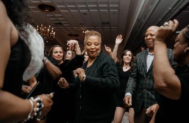 Packed dance floor at corporate event.