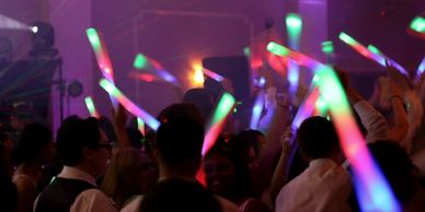 Great a glowstick and go hard with your guests to the beat.