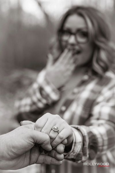 This captivating black and white portrait showcases a beaming bride. engagement shoot with our team.