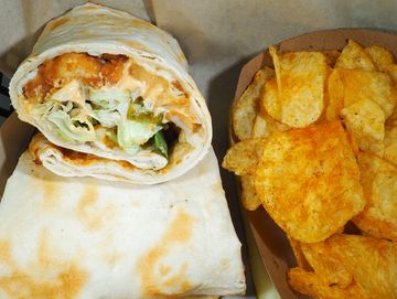 Cluckin' Good Chicken Sandwich with crispy chicken, mozzarella cheese, spicy mayo, pickles &lettuce
