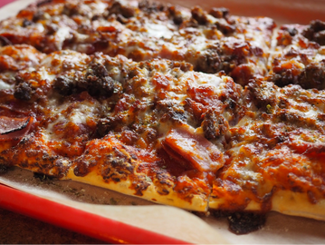 A delicious grand slam all-meat pizza