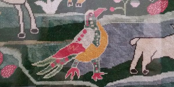 Petit point on a recent reproduction sampler.  Silk on linen.