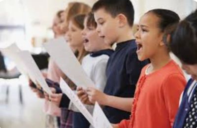 Children singing together in a choir.