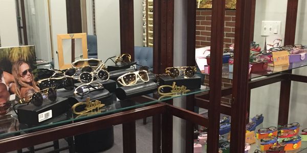A selection of designer eyewear is displayed in the fitting room of Dr. Kofos.