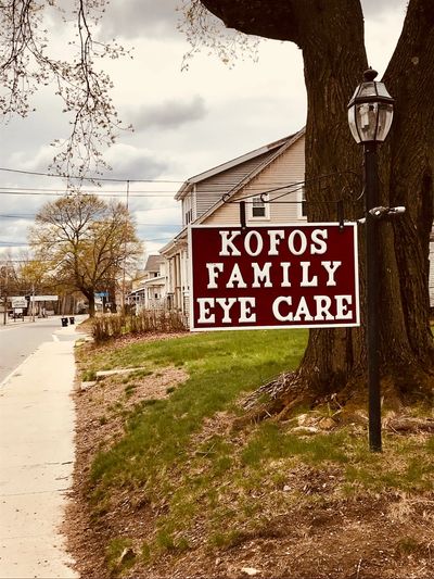 The sign for Kofos Family Eye Care as seen from Bolton Street.