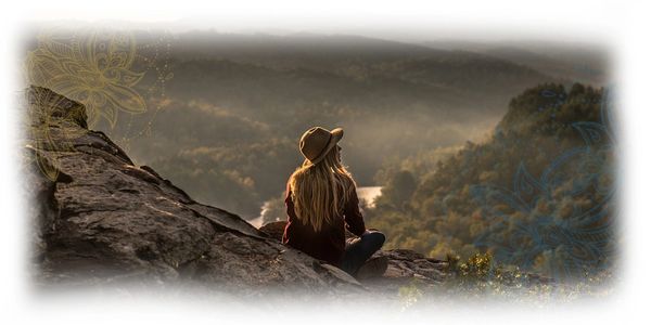 Women sitting on the side of a mountain