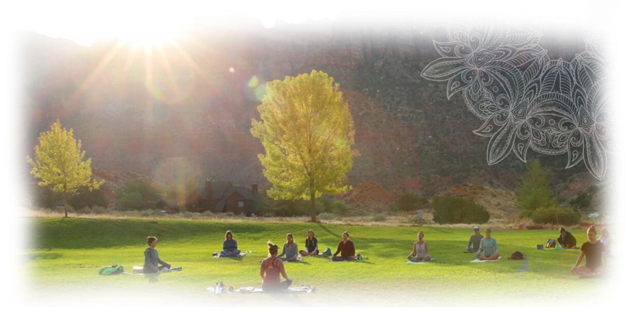 Zion retreat image of people sitting on the grass with mountain behind. 