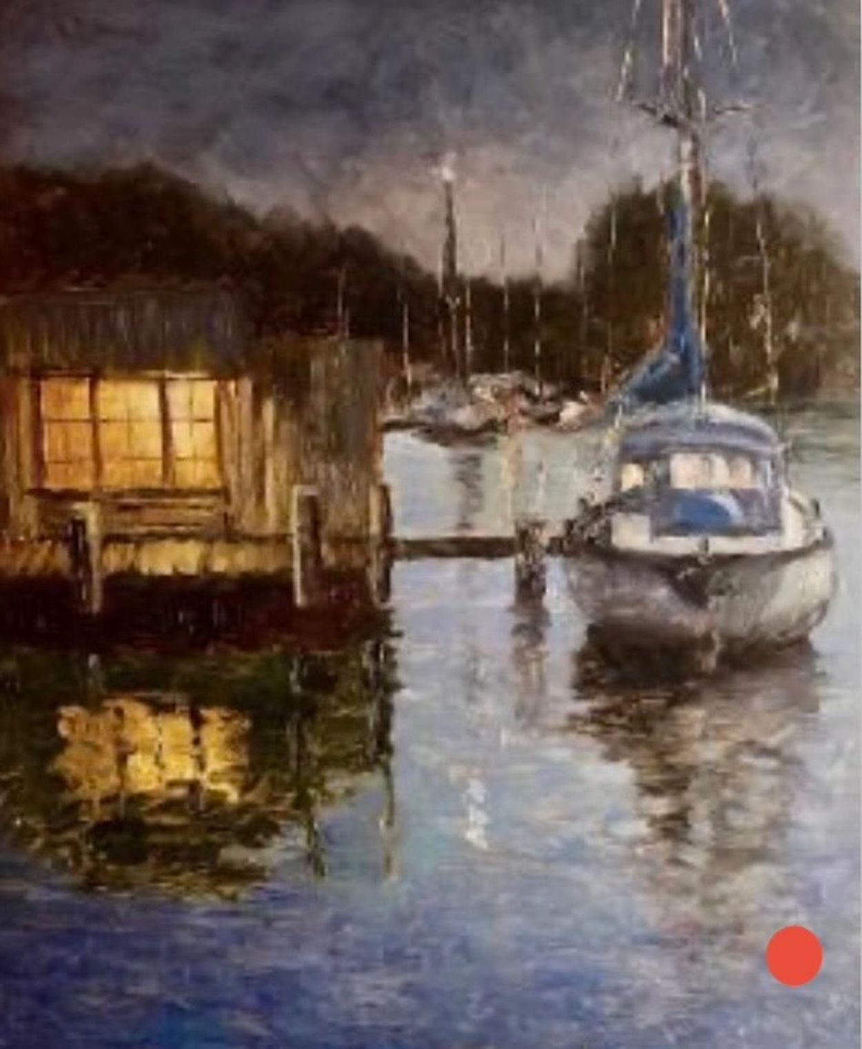 A serene harbor scene at dusk with a boat and glowing cabin reflection.