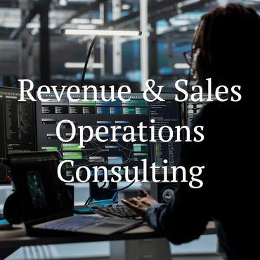 Professional working on multi-screen setup in a tech office.