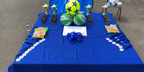 soccer equipment on a blue table.