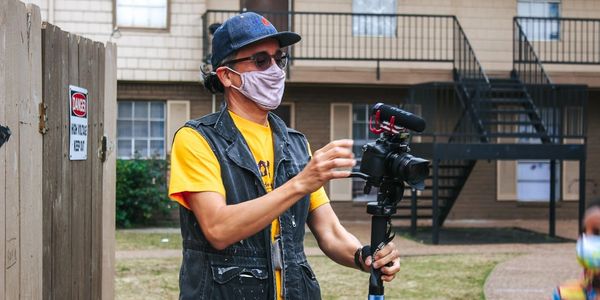 Image with man and camera.