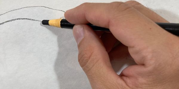Hand drawing a line.