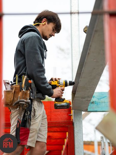 RFM team member working on Newport new home framing