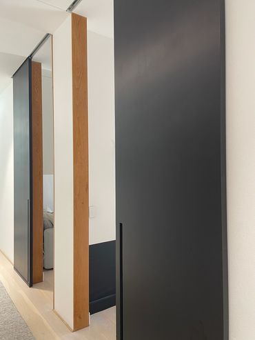 Custom hand made sliding doors with American Oak door revels