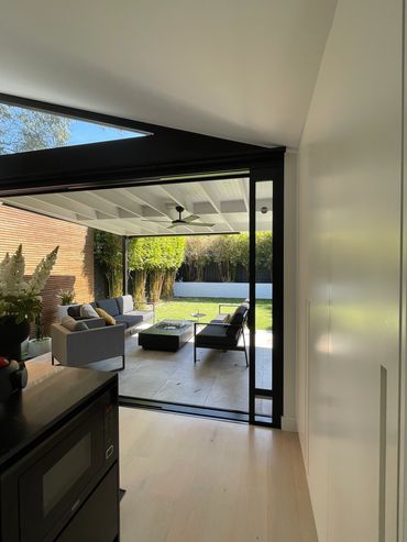 Kitchen view looking out on covered patio entertaining area