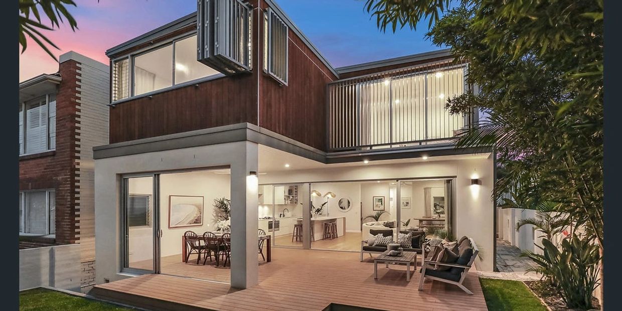 Rear view of Curl Curl Northern Beaches home with wood feature details, outdoor entertaining