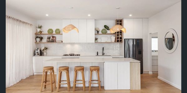 Custom kitchen with White Island and stone finishes and white and wood cabinetry