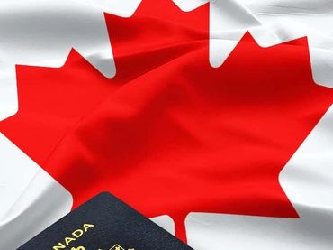 Canadian passport on a Canadian flag.