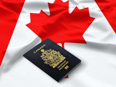 Canadian passport on a Canadian flag.