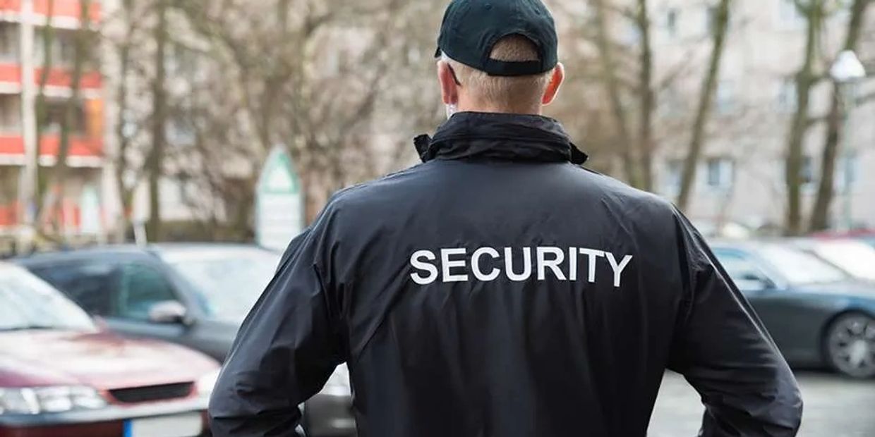 Physical Guards watching over vehicles for break ins.
