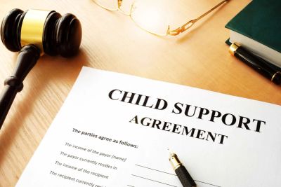 Child support agreement document with a pen and gavel.