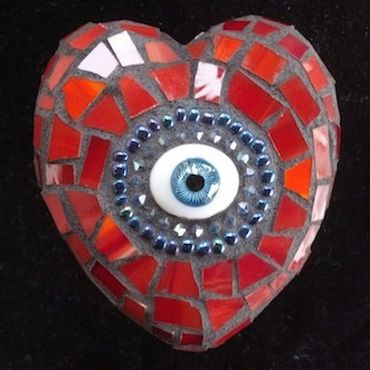Mosaic heart.  Foam, mesh, concrete, stainglass, glass beads, glass eye, mortar.