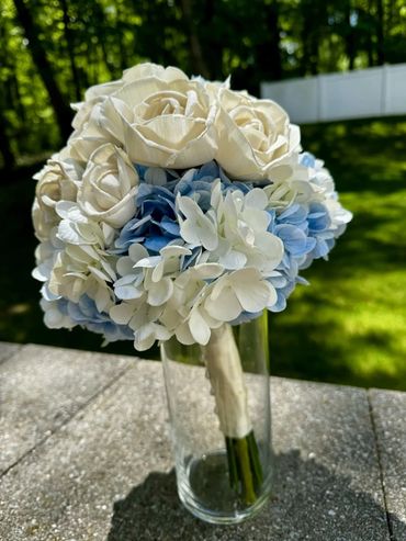 white rose and blue hydrangea bridal bouquet with wood flowers