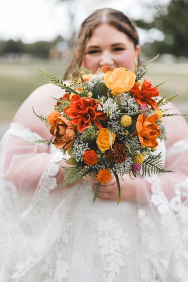 wildflower bouquet with orange, red, yellow wood flowers and queen annes lace