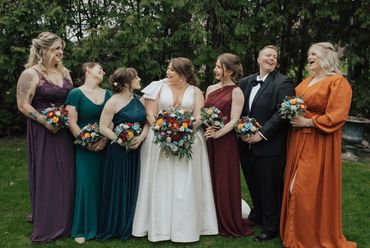 cascading bridal bouquet and garden style bridesmaids bouquets with gem color scheme