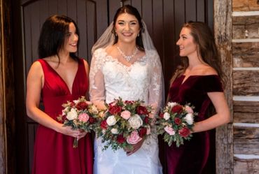 garden style bridal bouquet and bridesmaid bouquet with burgundy, pink, and white roses
