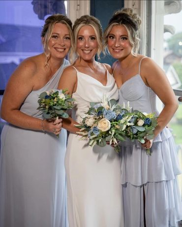 garden style bouquets with eucalyptus and blue roses and white roses