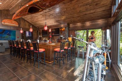West Bloomfield, MI - Custom carpentry bar construction with custom built walnut bar top, wood ceilig