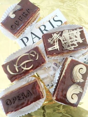 A classic in French pâtisserie : a layered almond Joconde biscuit soaked in coffee, wrapped in alter