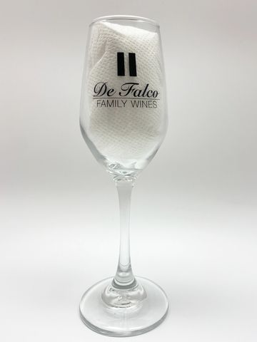 champagne glass with defalco family wines logo on it in black