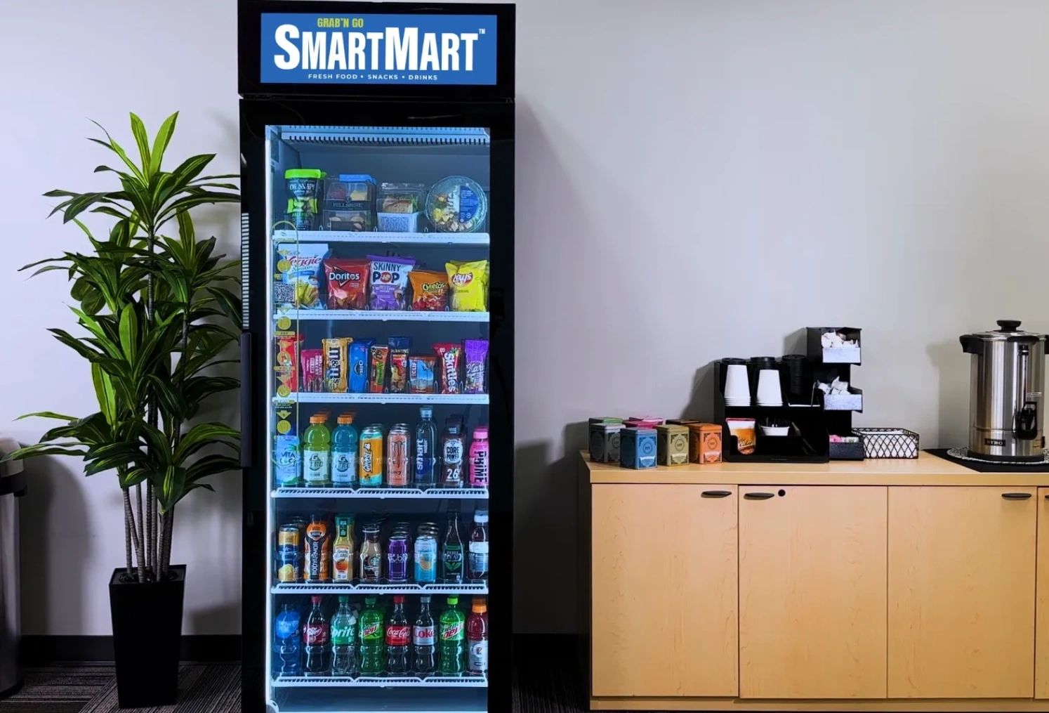 Image of a SmartMart AI powered vending machine, filled with a variety of snacks.