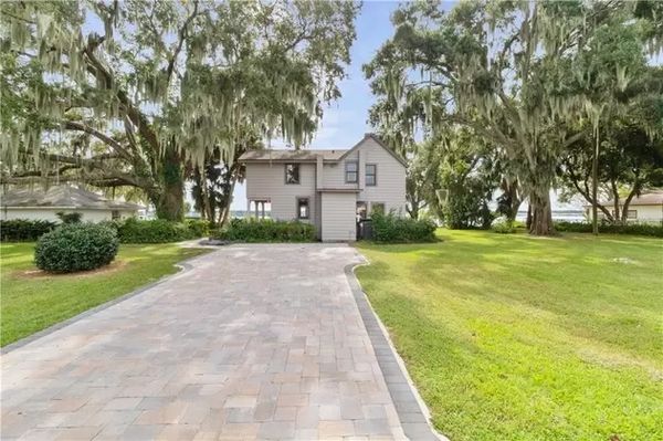 Trimmed overgrown shrubs and trees at property near Lake Ariana in Auburndale Florida