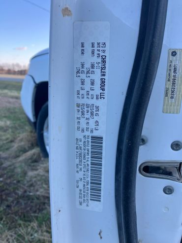 Chrysler vehicle manufacturing label with weight and tire specifications.