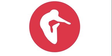 White dancing figure in a red circle.