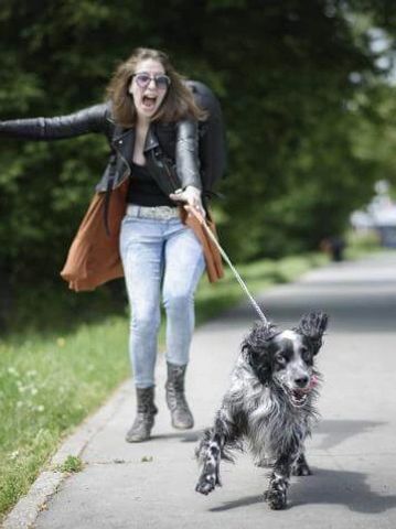 woman being pulled by her dog
