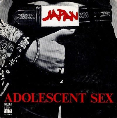 Black and white photo of a person with a 'Japan' belt buckle and 'Adolescent Sex' text.