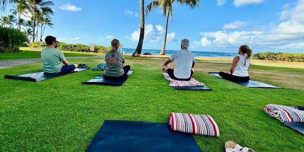 Meditation class facing the ocean.