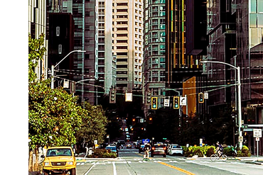 A image of a street and building in downtown Seattle Washington.
