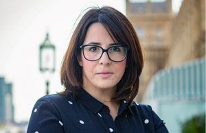 Image of Fay Jones MP standing outside the House of Parliament. Image from her webite