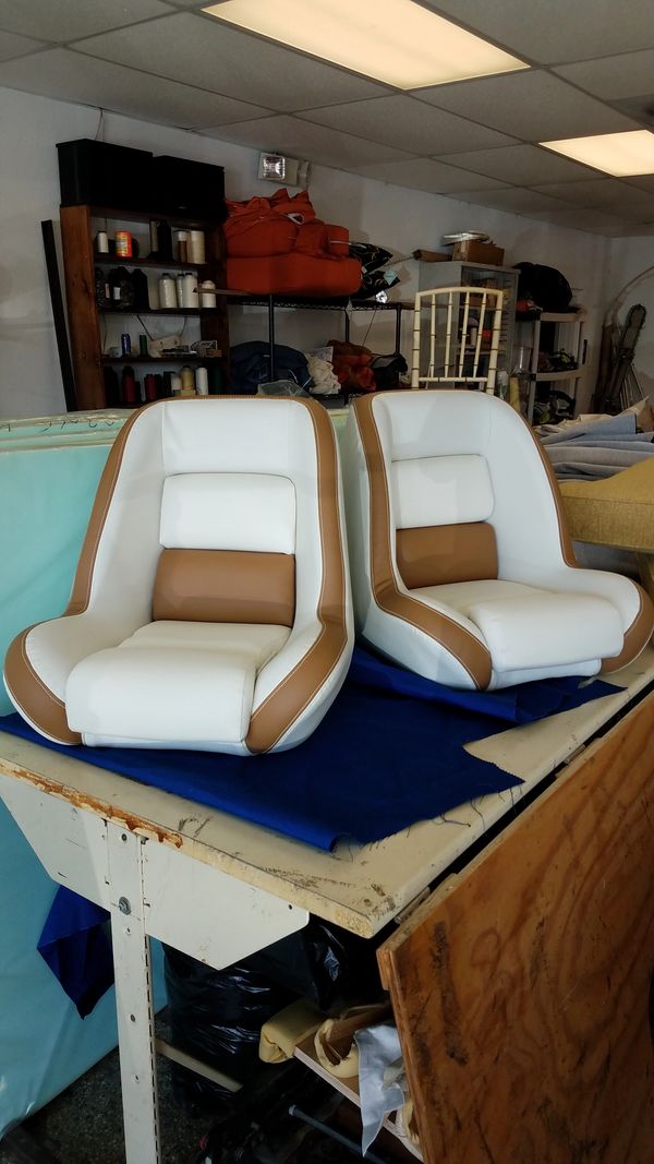 matching captain and passenger chairs padded and custom-designed for a yacht
